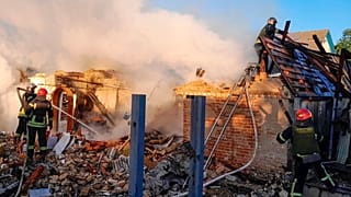 Rescuers work at a damaged building after a Russian missile attack in Ukraine's Kyiv region.