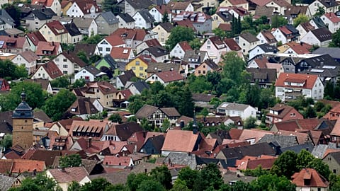 Residential houses in the town of Bad Staffelstein are pictured from the Staffelberg hill in Germany