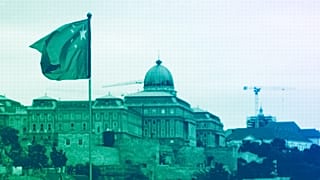 A Chinese national flag with the Buda Castle in the background waves in Budapest, May 2024