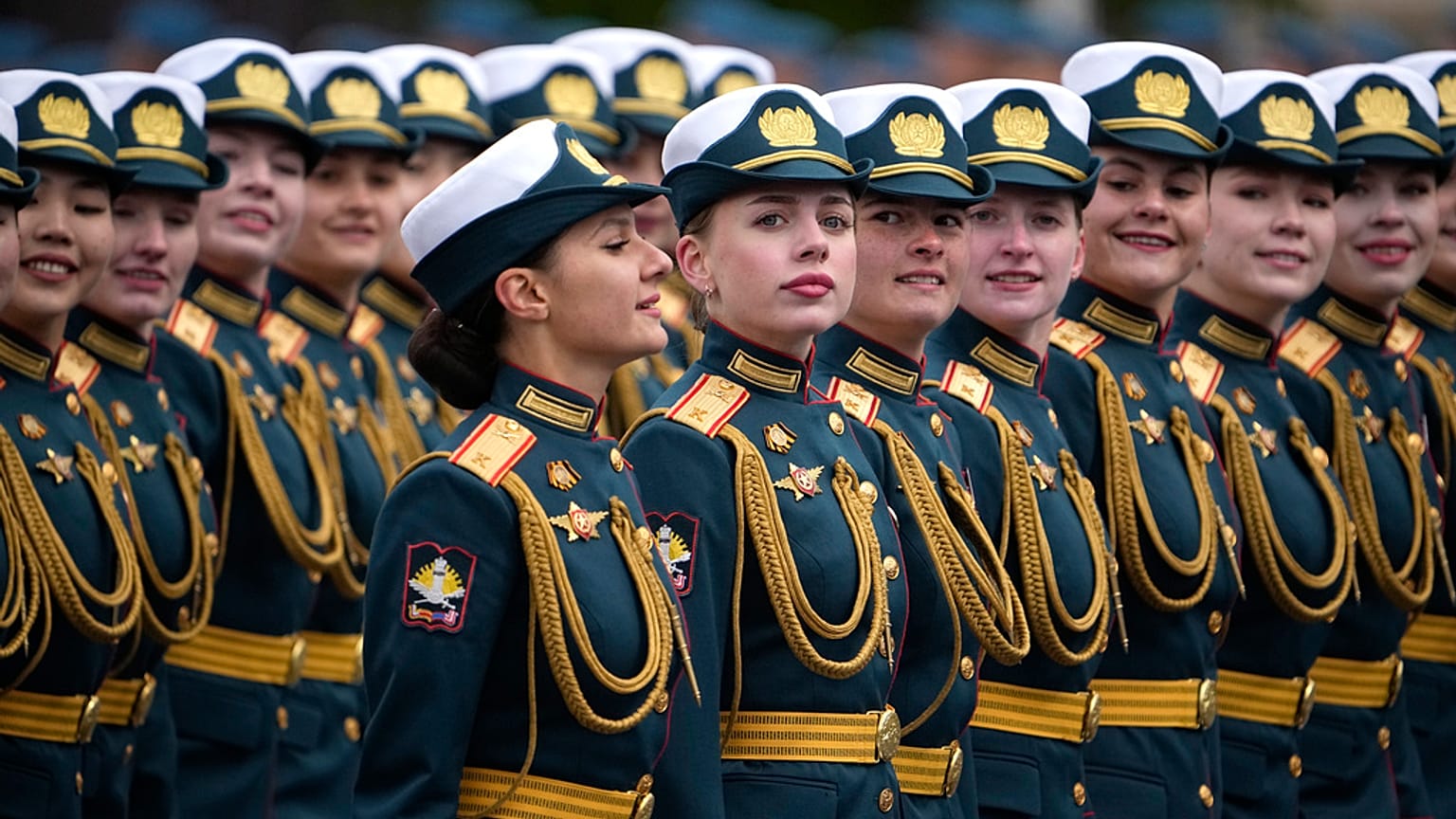 Russian servicewomen march during the Victory Day military parade in Moscow, Russia, Thursday, May 9, 2024.