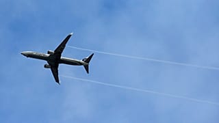 FILE - An Alaska Airlines Boeing-made airplane flies above Boeing's newly expanded 737 delivery center, Monday, Oct. 19, 2015.