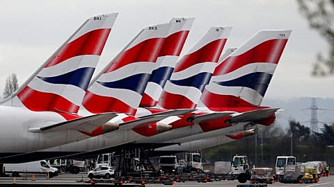 In this Wednesday, March 18, 2020 file photo, British Airways planes parked at Terminal 5 Heathrow airport in London.