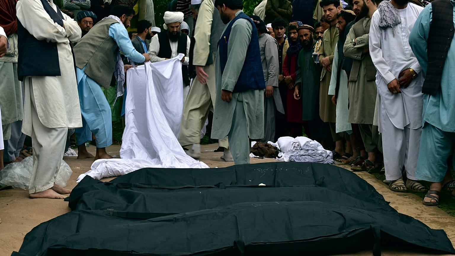 Dead bodies after heavy flooding in Baghlan province in northern Afghanistan Saturday, May 11, 2024. 