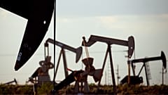 Pump jacks work in a field near Lovington in the US. 