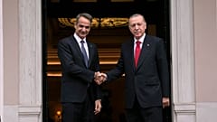 FILE - Greece's Prime Minister Kyriakos Mitsotakis, left, welcomes the Turkey's President Recep Tayyip Erdogan before their meeting at Maximos Mansion in Athens, Greece in 202