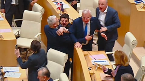 This photo taken from video, released by Mtavari Channel on Tuesday, May 14, 2024, shows Georgian lawmakers fighting during a parliament session in Tbilisi, Georgia.