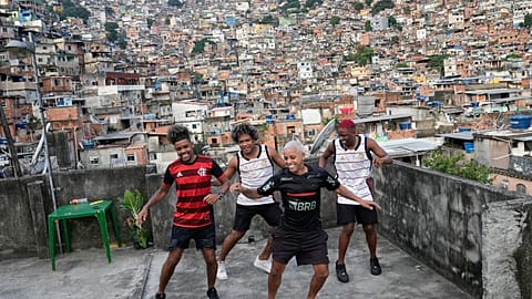 Youth perform a street dance style known as passinho for their social media accounts, in the Rocinha favela of Rio de Janeiro, Brazil, Wednesday, April 17, 2024.