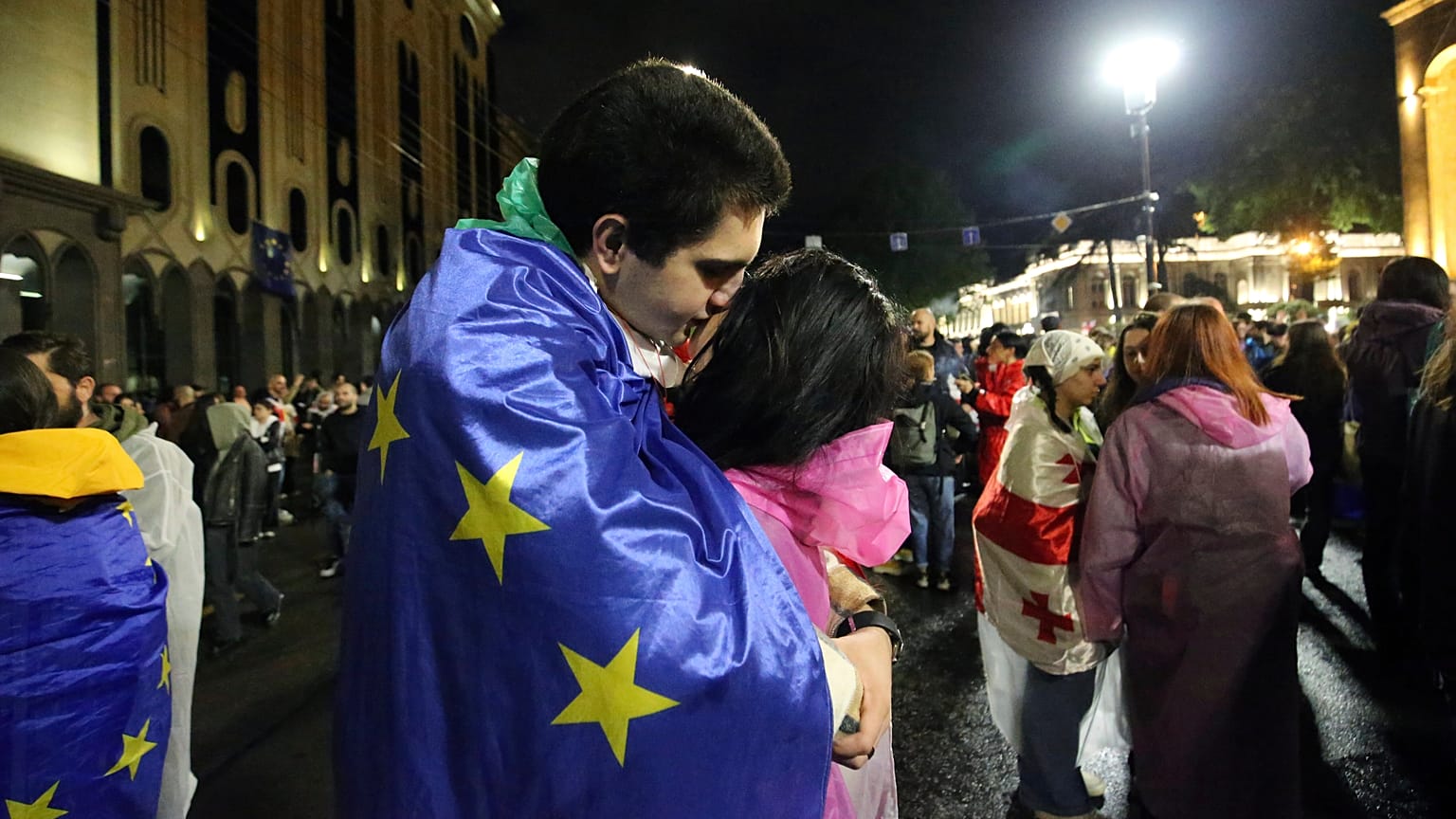 A man and a woman participate in a protest against the so-called "Russian law" in Tbilisi, Georgia, May 2024.