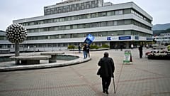 People walk outside the F. D. Roosevelt University Hospital, where Slovak Prime Minister Robert Fico is treated, in Banska Bystrica. Friday, May 17, 2024.