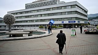 People walk outside the F. D. Roosevelt University Hospital, where Slovak Prime Minister Robert Fico is treated, in Banska Bystrica. Friday, May 17, 2024.