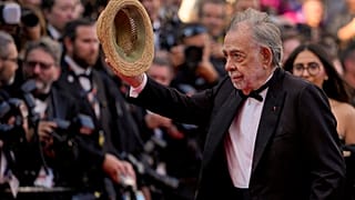 Director Francis Ford Coppola poses for photographers upon arrival at the premiere of the film 'Megalopolis' 