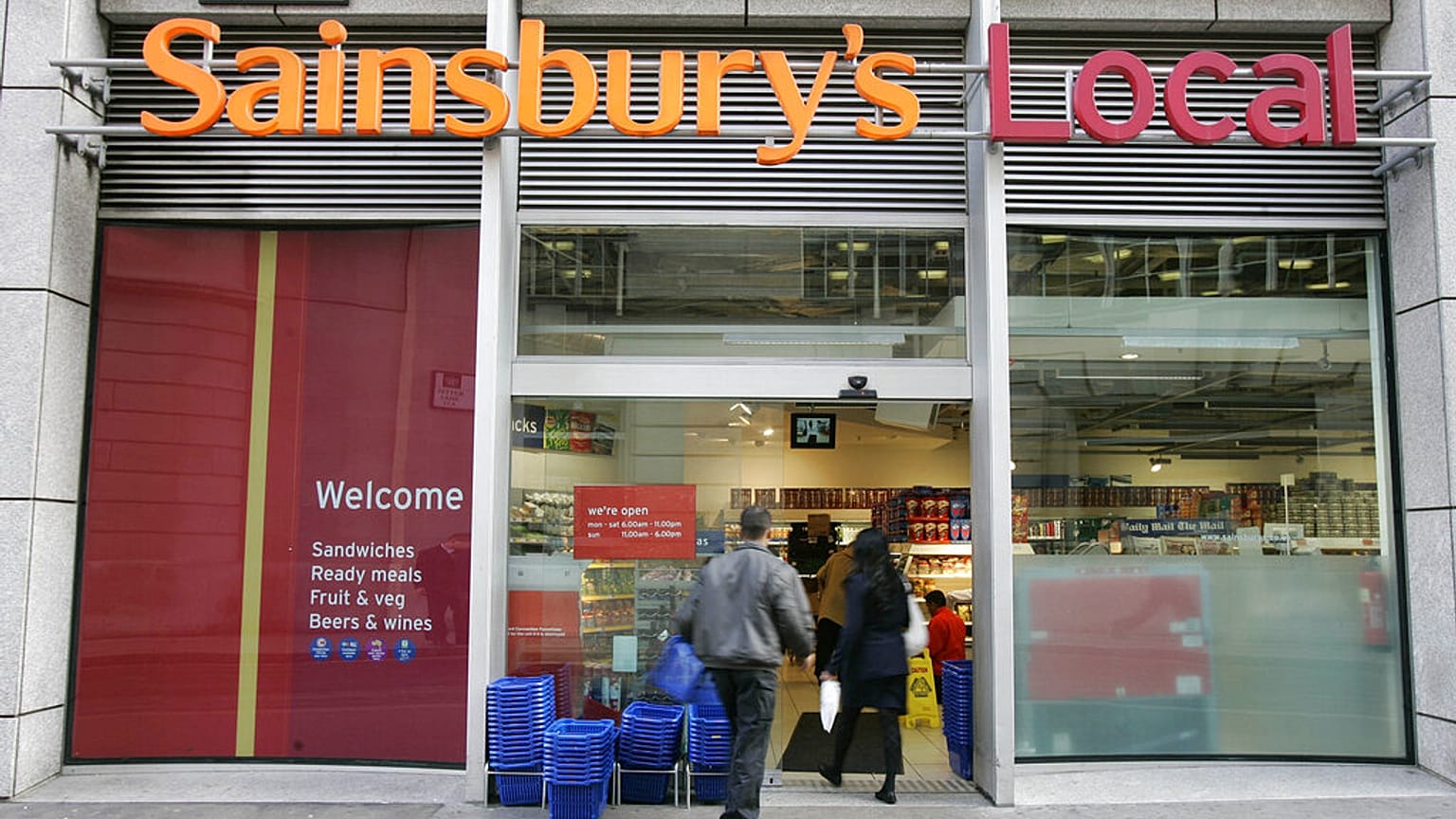 The company logo for the Sainsbury's food store chain at their Holborn building in London, Monday Nov. 20, 2006. (AP Photo/Alastair Grant)