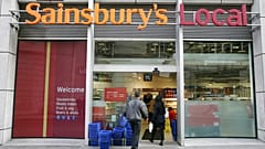 The company logo for the Sainsbury's food store chain at their Holborn building in London, Monday Nov. 20, 2006. (AP Photo/Alastair Grant)