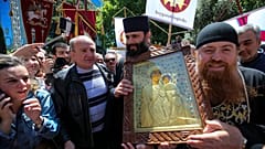 People and Georgian Orthodox Church priests gather to celebrate the Day of Family Purity in front of the Georgian Parliament's building in Tbilisi, Georgia