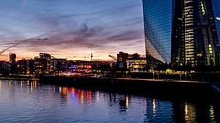 Colourful lights burn in the window of a restaurant near the European Central Bank, right, in Frankfurt, Germany, late Friday, May 3, 2024.