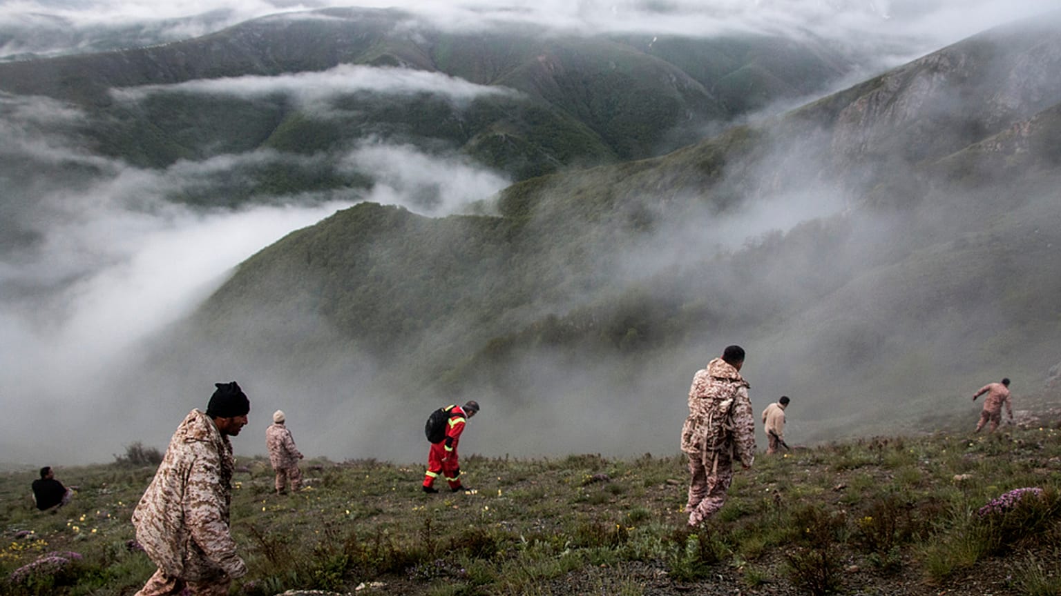 In this photo provided by Moj News Agency, rescue team members search for the wreckage of the helicopter carrying Iranian President Ebrahim Raisi.Monday, Feb. 21, 2022 