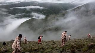 In this photo provided by Moj News Agency, rescue team members search for the wreckage of the helicopter carrying Iranian President Ebrahim Raisi.Monday, Feb. 21, 2022