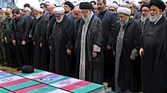 Supreme Leader Ayatollah Ali Khamenei leads a prayer over the flag-draped coffins of the late President Ebrahim Raisi and his companions who were killed in a helicopter crash