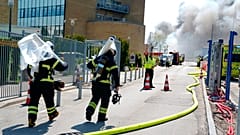 Firefighters work to extinguish a fire at the Novo Nordisk headquarters in Bagsvaerd, near Copenhagen, Denmark.