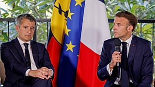 French President Emmanuel Macron sits next to France's Minister for Interior and Overseas Darmanin during a meeting with New Caledonia's elected officials, May 23, 2024.