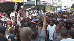 تشييع جثامين 11 فلسطينياً من بين 12 آخرين قتلوا في غارة إسرائيلية في جنين، الضفة الغربية المحتلة.