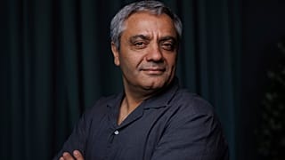 Iranian director Mohammad Rasoulof poses for a portrait photograph for the film 'The Seed of the Sacred Fig' at the 77th international film festival, Cannes