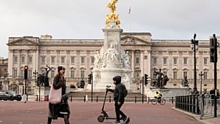A general view of Buckingham Palace one, of the official residences of King Charles III, as pedestrians walk past in London, Tuesday, Feb. 6, 2024.