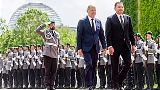German Chancellor Olaf Scholz, centre, and Portugal's Prime Minister Luis Montenegro walk during their meeting at the Federal Chancellery in Berlin, Friday, May 24, 2024.