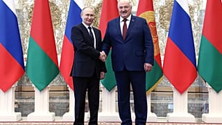 Russian President Vladimir Putin, left, and Belarusian President Alexander Lukashenko shake hands during a welcome ceremony at the Palace of Independence in Minsk, Belarus.