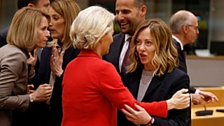 Italy's Prime Minister Giorgia Meloni, right, speaks with European Commission President Ursula von der Leyen during a round table meeting at an EU summit in Brussels.