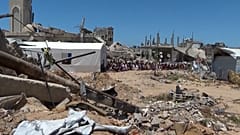 In the southern city of Khan Younis in the Gaza Strip, dozens of people attended Friday prayers near the destroyed Islam Mosque. 