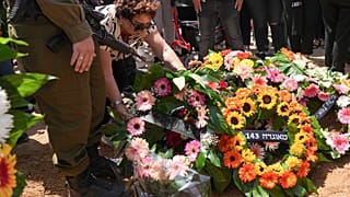 Mourners attend the funeral of Michel Nisenbaum, who was killed during Hamas' Oct. 7 attack and whose body was taken into Gaza, in Ashkelon, Israel, on Sunday, May 26, 2024. 