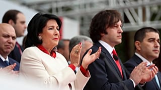 President Salome Zourabichvili, left, and Prime Minister Irakli Kobakhidze, right, attend a celebration for Independence Day in Tbilisi, May 26, 2024