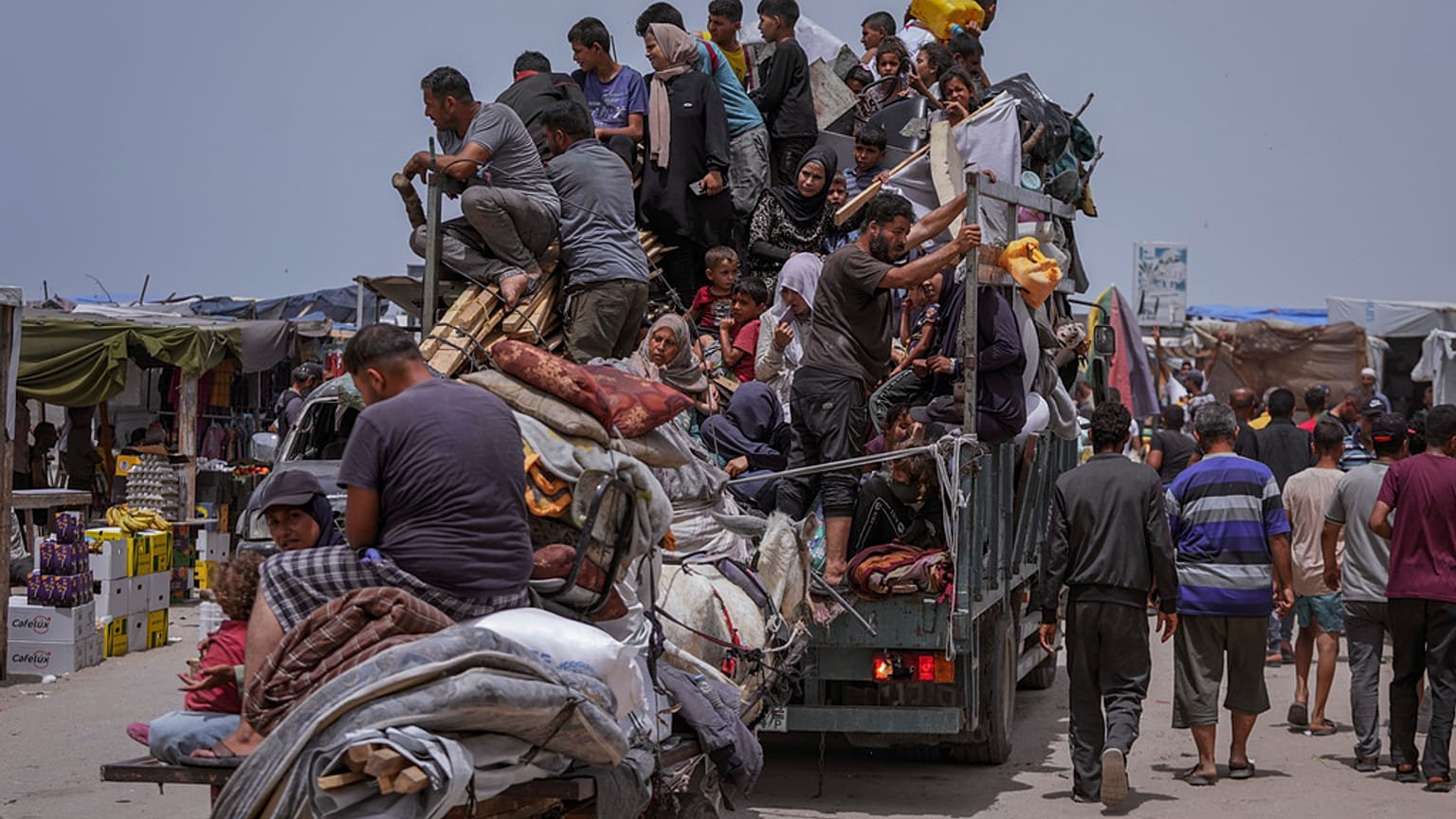 Palestinians fleeing from the southern Gaza city of Rafah during an Israeli ground and air offensive in the city on Tuesday, May 28, 2024.