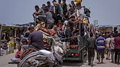 Palestinians fleeing from the southern Gaza city of Rafah during an Israeli ground and air offensive in the city on Tuesday, May 28, 2024.