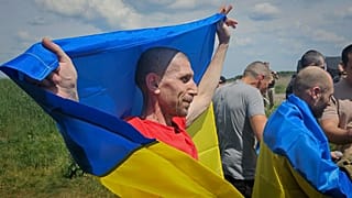 Ukrainian prisoners of war react after a prisoner exchange at an undisclosed location in Ukraine, 31 May 2024
