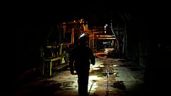 A worker walks along an internal corridor in a damaged DTEK thermal power plant after a Russian attack in Ukraine, Thursday, May 2, 2024.