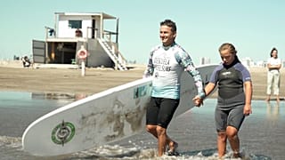 Watch: Pro-surfer paves the way for disabled students to catch waves in Argentina