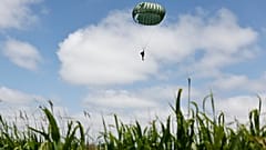 Parachute drop in Carentan-Les-Marais in Normandy, France on Sunday ahead of D-Day 80th anniversary commemorations
