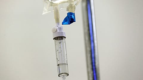Chemotherapy drugs are administered to a patient at a hospital