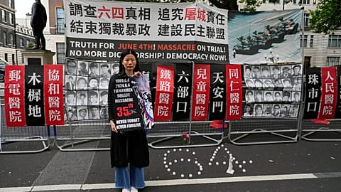 A demonstrator in London at a candlelight vigil to commemorate the 35th anniversary of the 1989 Tiananmen Square massacre
