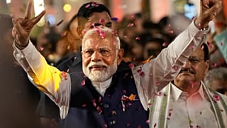 Prime Minister Narendra Modi greets supporters as he arrives at Bharatiya Janata Party (BJP) headquarters in New Delhi, India, Tuesday, June 4, 2024.