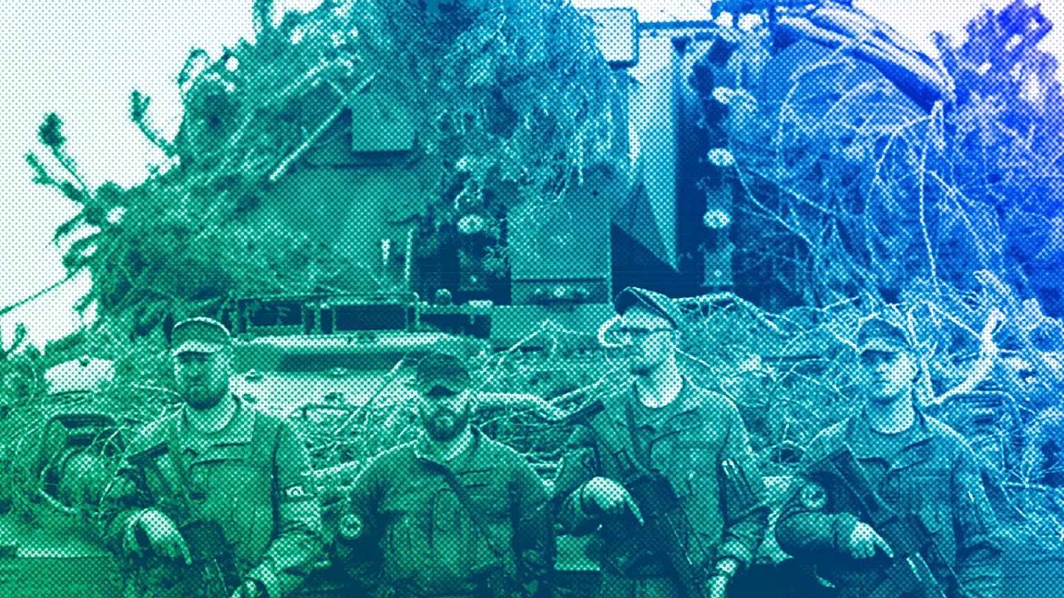 German Bundeswehr soldiers stand next to a self-propelled howitzer PzH 2000 of German Army at a training range in Pabrade, north of the capital Vilnius, May 2024
