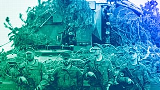 German Bundeswehr soldiers stand next to a self-propelled howitzer PzH 2000 of German Army at a training range in Pabrade, north of the capital Vilnius, May 2024