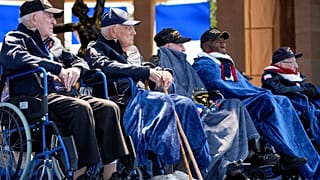 World War II veterans listen during a ceremony to mark the 80th anniversary of D-Day, Thursday, June 6, 2024, in Normandy.
