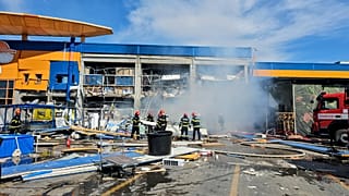 Romanian Emergency Services (ISU Botosani), firefighters work at the scene of an explosion at a chain DIY store in Botosani, Romania, Friday, June 7, 2024