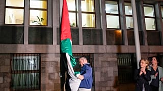 The Palestinian flag is raised in front of the Slovenian parliament building after the vote in Ljubljana, Slovenia, Tuesday, June 4, 2024.