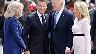 French President Emmanuel Macron, second left, his wife Brigitte Macron, left, welcome President Joe Biden and First Lady Jill Biden before a ceremony at the Arc de Triomphe, 