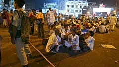 FILE - Indian paramilitary soldier stands guard as pilgrims head to cave shrine of Mata Vaishno Devi. Sept. 22, 2009