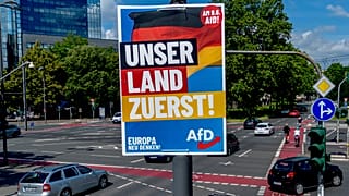An election poster of German far right AfD party is fixed on a lamp pole in Frankfurt, Germany